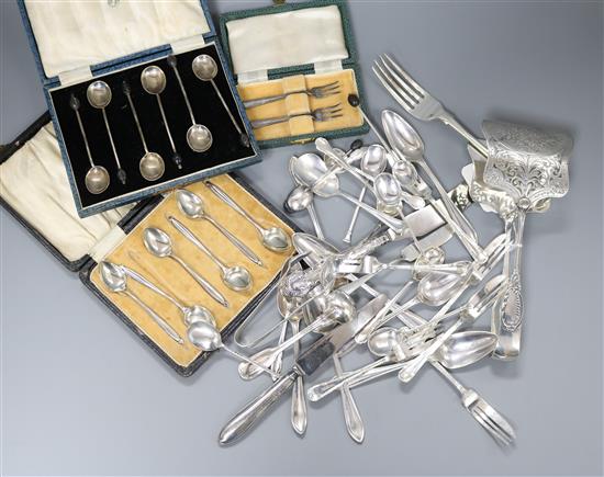 A pair of late Victorian silver tart servers and a small group of assorted silver flatware including pastry forks, teaspoons etc.